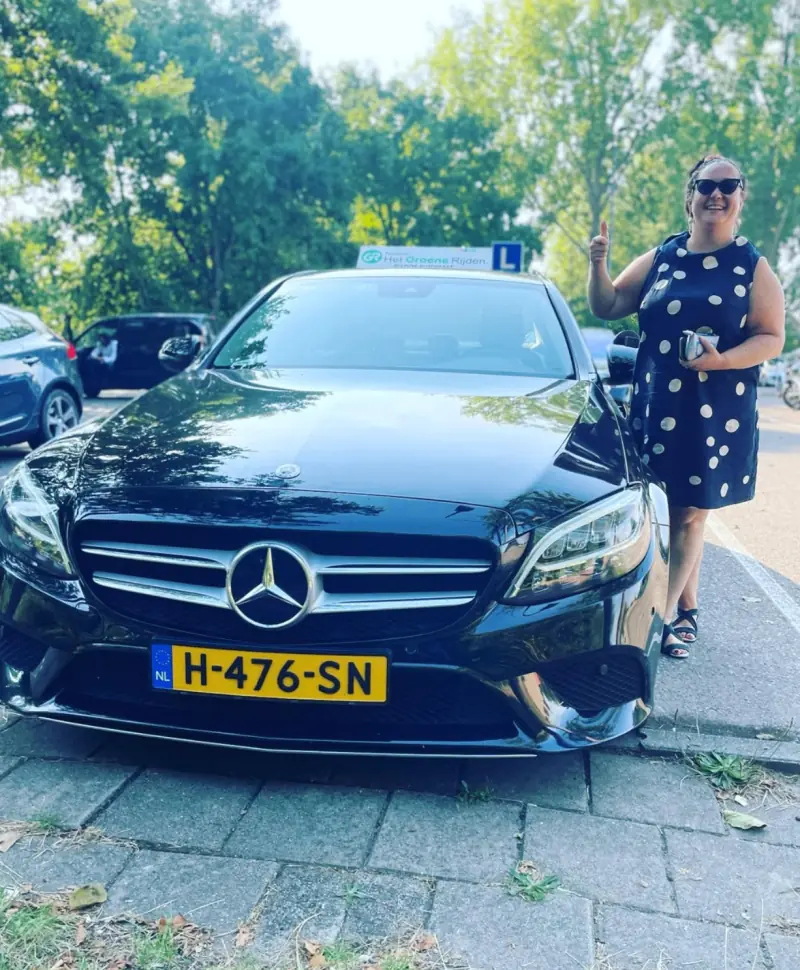 Driving School Leiden student in front of the CBR exam centre in Leiden after passing
