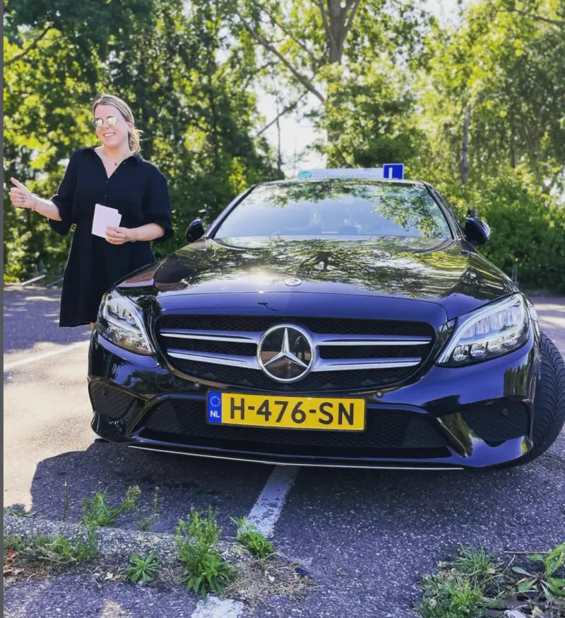 International student receiving her Dutch driving licence with Driving School Leiden in Leiden